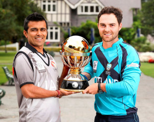 Khurram Khan and Preston Mommsen pose with the World Cup 2015 Qualifier trophy on the eve of the final between UAE and Scotland in Lincoln &copy; IDI/Getty Images