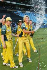 Emma Liddell sprays champagne as Australia's World Cup celebrations begin &copy; AFP