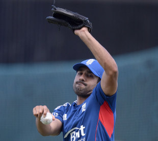 Can you flick it? Ravi Bopara tries his hand at Sunil Narine-style bowling &copy; Getty Images