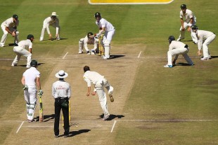 Nathan Lyon bowls to Kyle Abbott with plenty of catchers on the final morning in Cape Town &copy; Getty Images