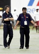 Billy Bowden and an official inspect the covers at the Sinhalese Sports Club ahead of the second ODI between Sri Lanka and India &copy; AFP