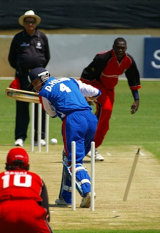David Hemp is bowled by Henry Osinde during Canada's three-wicket win over Bermuda &copy; ICC