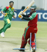 Brendan Taylor drags on his pull to hand Mashrafe Mortaza a third wicket during Bangladesh's tense one-wicket win at Harare &copy; AFP