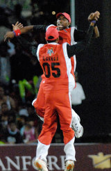 Sherwin Ganga and Dwayne Bravo celebrate another Jamaican wicket as Trinidad and Tobago win the Stanford 20/20 &copy; Stanford 20/20