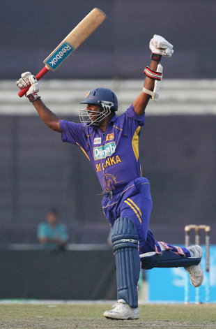 A delighted Muttiah Muralitharan celebrates a remarkable two-wicket win for Sri Lanka over Bangladesh in Mirpur &copy; AFP