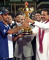 Marvan Atapattu receives the trophy after Sri Lanka's 25-run victory over India in the Asia Cup final &copy; CricInfo Ltd