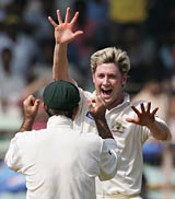 Michael Clarke celebrates on his way to 6 for 9 &copy; Getty Images